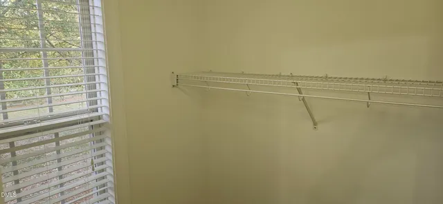 a view of a hallway with closet area