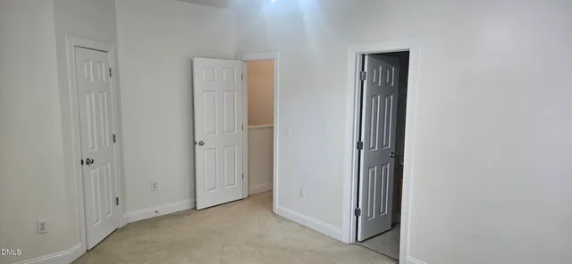 a white toilet sitting next to a bath tub