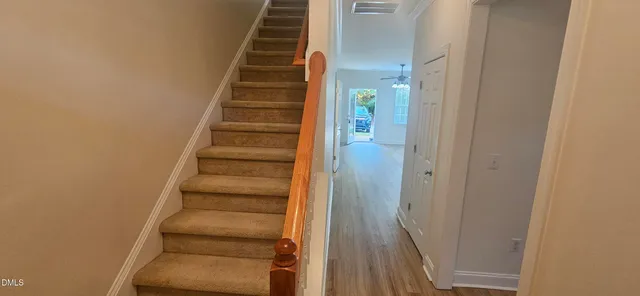 a view of room with window and ceiling fan