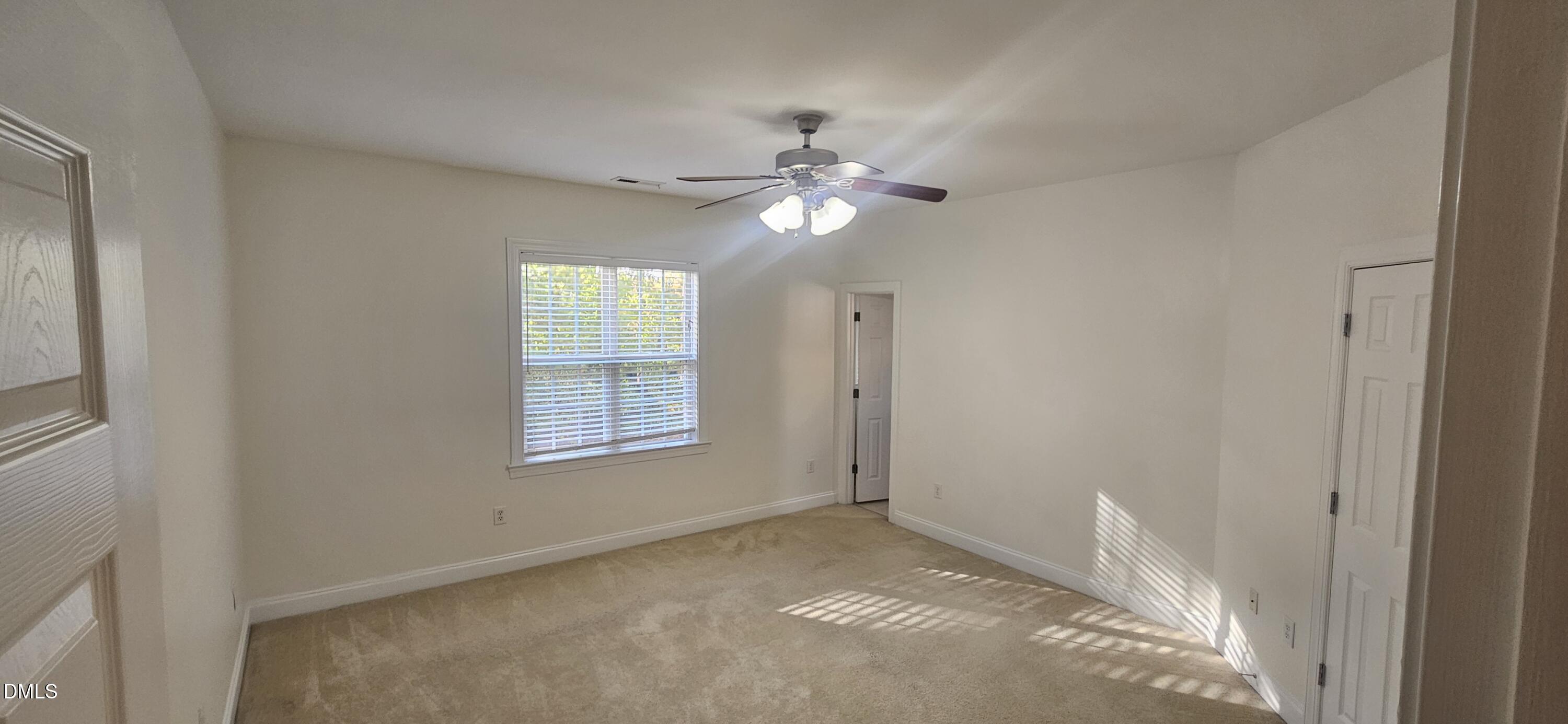 138 West Savannah Ridge Road Holly Springs, NC 27540 - Photo 10 of 22 a view of room with window and ceiling fan