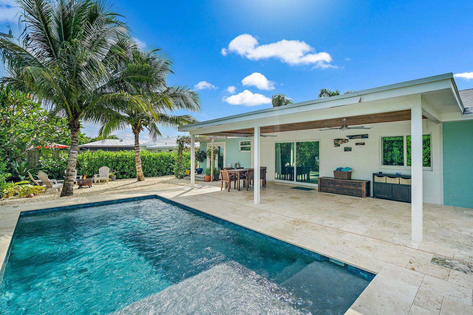 356 Mars Avenue Tequesta, FL 33469 - Photo 6 of 26 a view of a house with backyard porch and sitting area