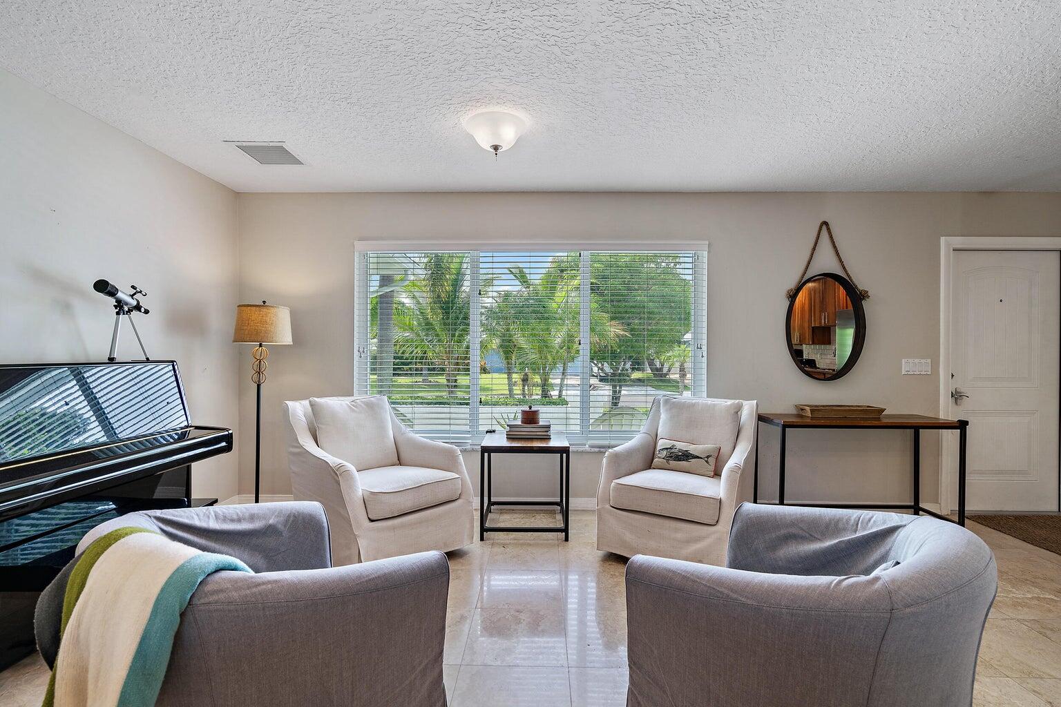 356 Mars Avenue Tequesta, FL 33469 - Photo 10 of 26 a living room with furniture and a window