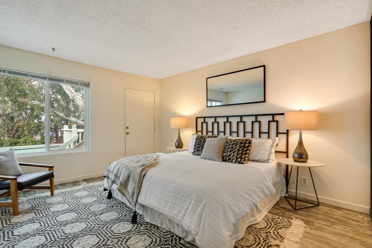 37050 Meadowbrook Common, Unit 302 Fremont, CA 94536 - Photo 13 of 21 a bedroom with a bed and a window