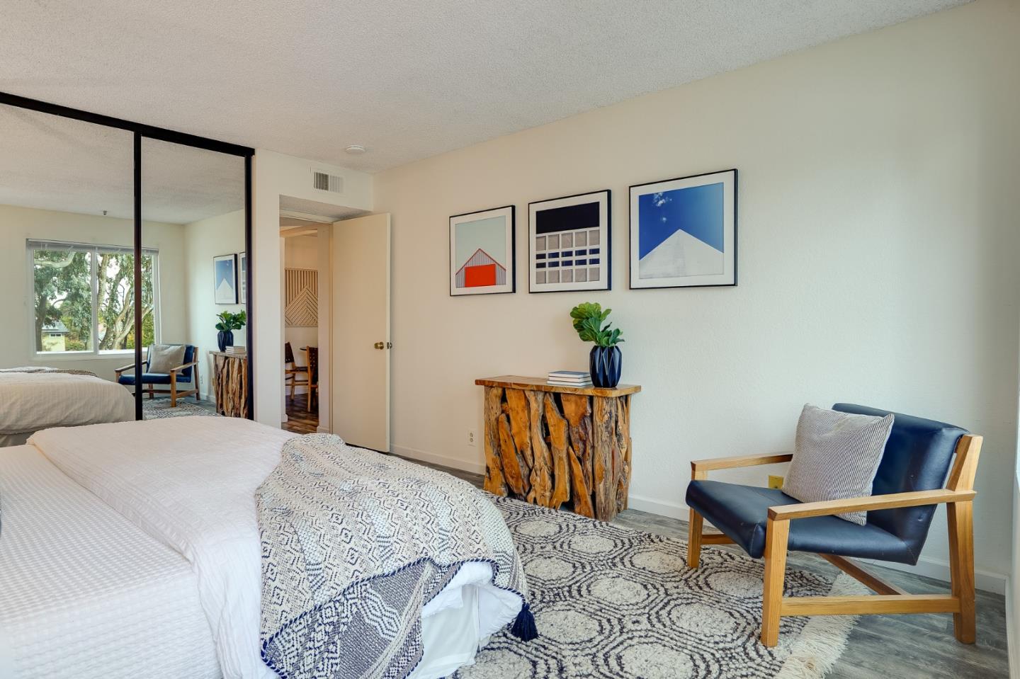 37050 Meadowbrook Common, Unit 302 Fremont, CA 94536 - Photo 14 of 21 a bedroom with a bed and wooden floor