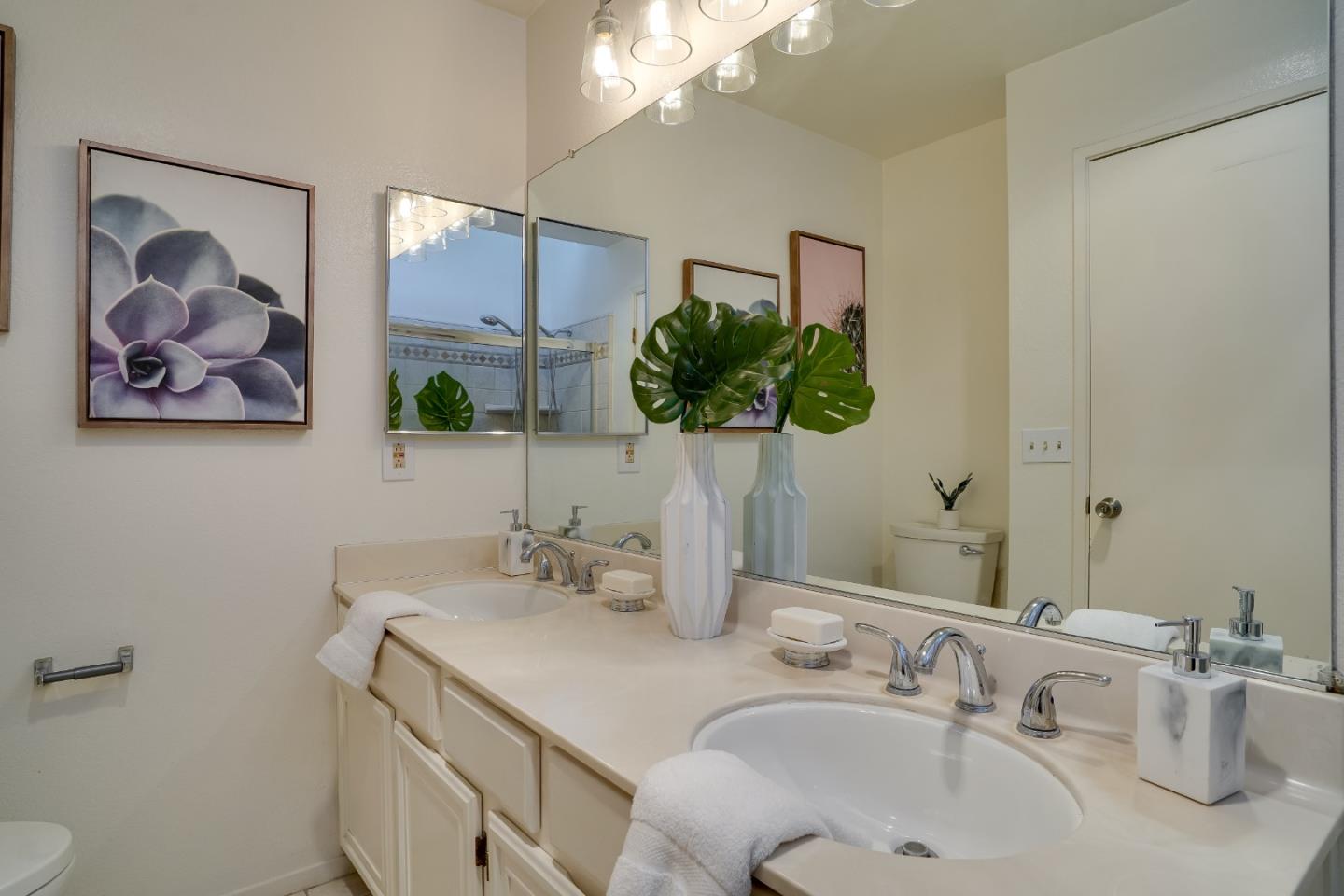 37050 Meadowbrook Common, Unit 302 Fremont, CA 94536 - Photo 16 of 21 a bathroom with a sink and a mirror