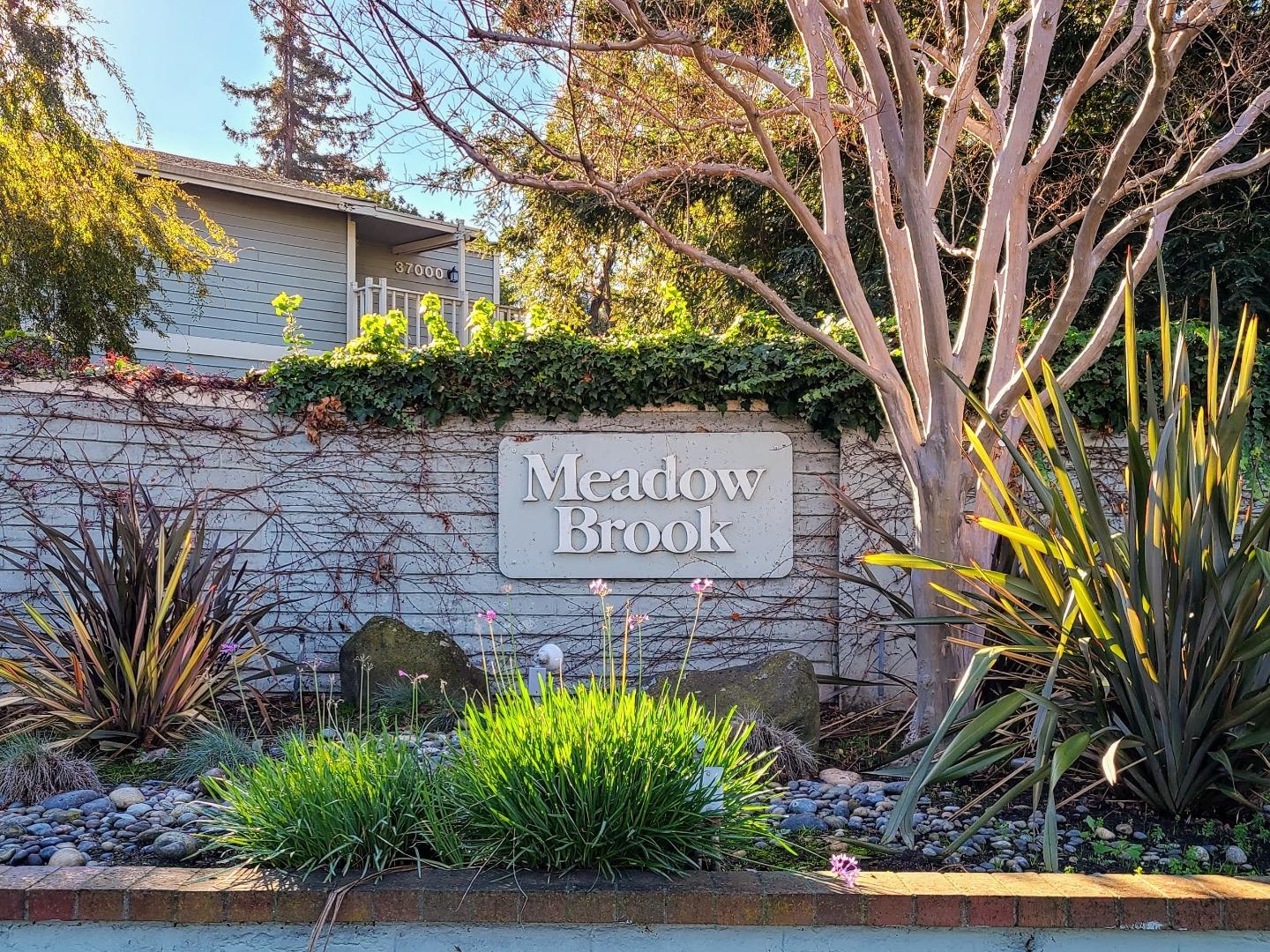 37050 Meadowbrook Common, Unit 302 Fremont, CA 94536 - Photo 21 of 21 a sign on the side of a building