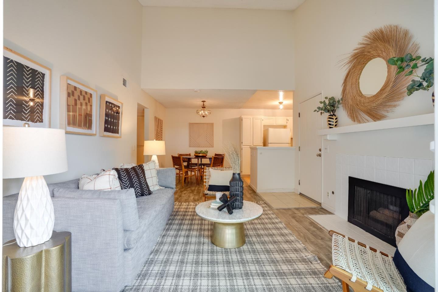 37050 Meadowbrook Common, Unit 302 Fremont, CA 94536 - Photo 4 of 21 a living room with furniture a fireplace and a table