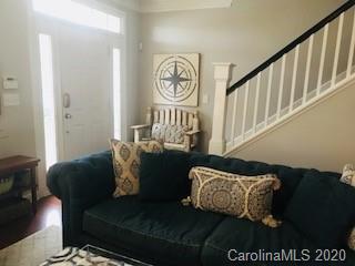 122 Singleton Road Mooresville, NC 28117 - Photo 4 of 8 a living room with furniture and a table