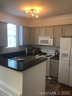 122 Singleton Road Mooresville, NC 28117 - Photo 6 of 8 a kitchen with a refrigerator and a stove