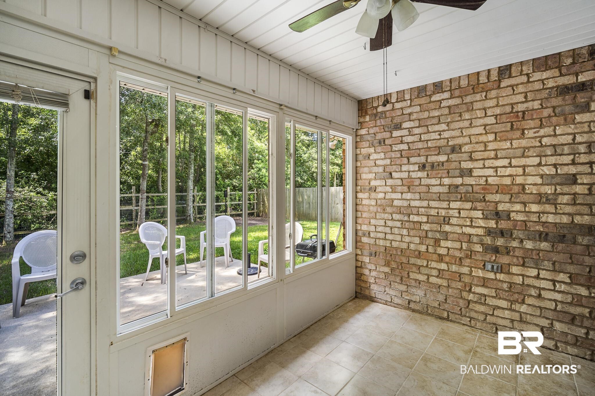 9814 Woolrich Avenue Fairhope, AL 36532 - Photo 22 of 29 Unfurnished sunroom with ceiling fan