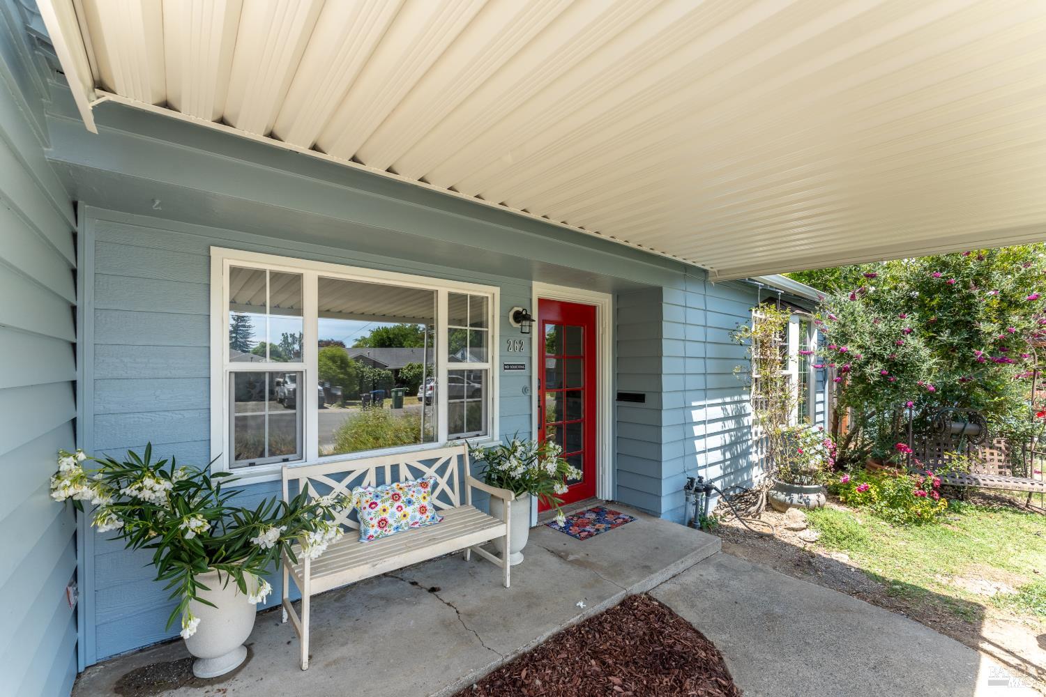 262 Magnolia Street Ukiah, CA 95482 - Photo 1 of 34 a balcony with furniture and potted plants