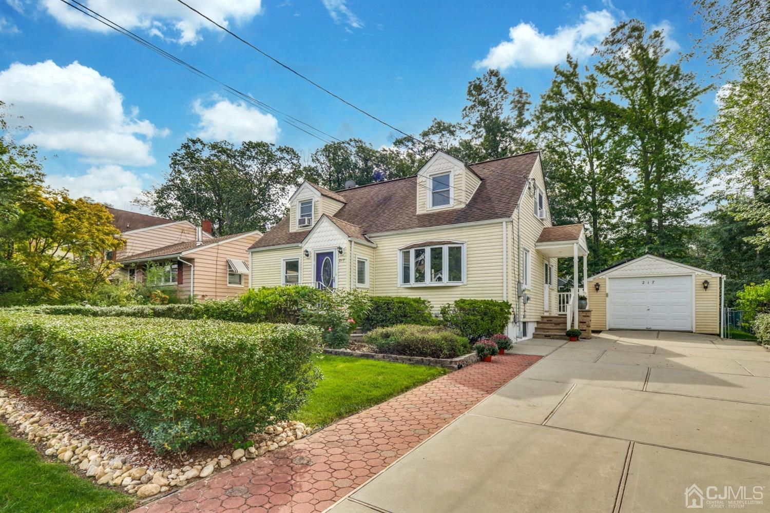 217 Oxford Road Edison, NJ 08820 - Photo 1 of 27 a front view of a house with a garden