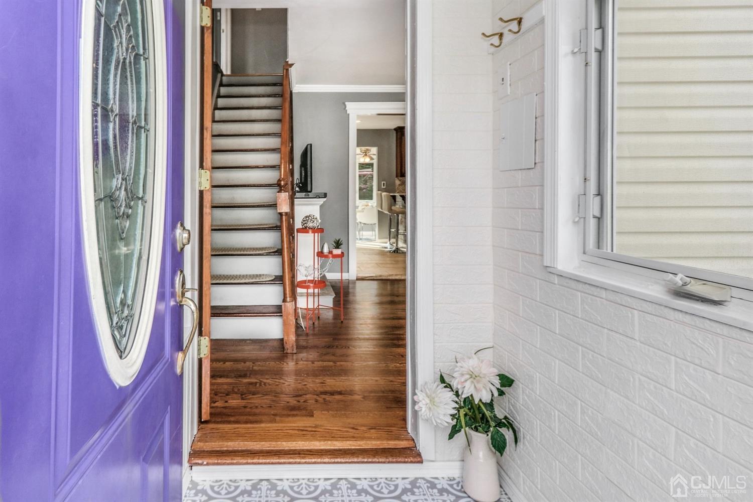 217 Oxford Road Edison, NJ 08820 - Photo 2 of 27 a view of entryway with wooden floor