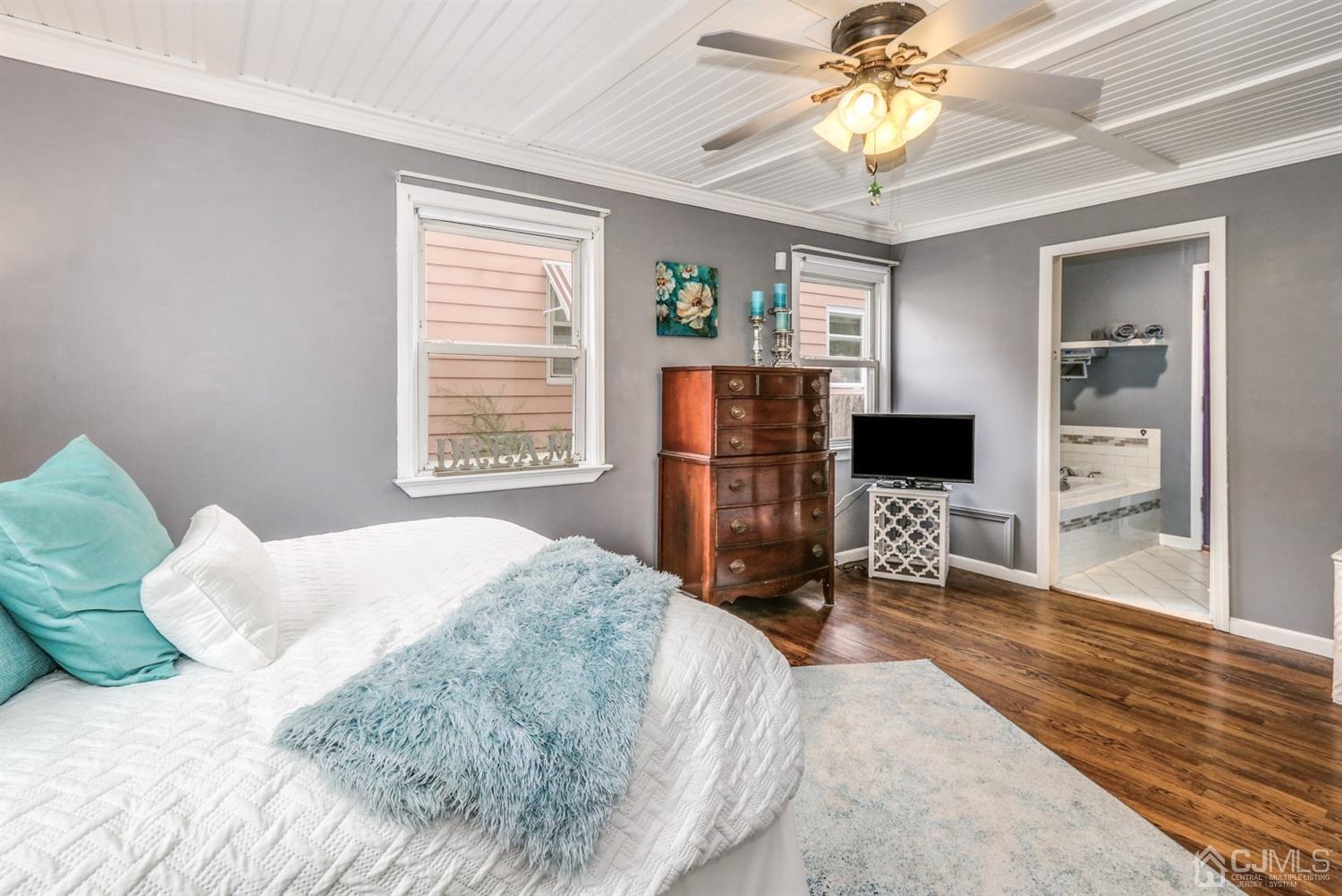 217 Oxford Road Edison, NJ 08820 - Photo 13 of 27 a bedroom with a bed and a flat screen tv
