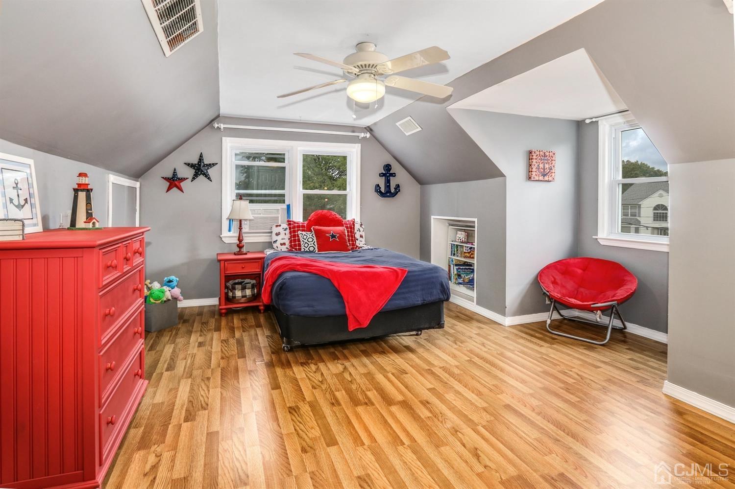 217 Oxford Road Edison, NJ 08820 - Photo 18 of 27 a bedroom with a bed and a chandelier