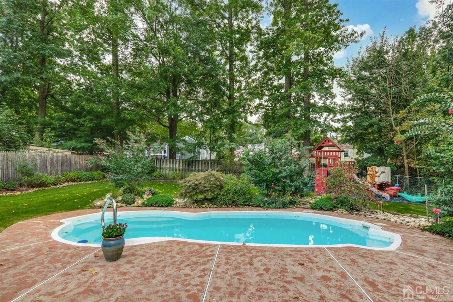 217 Oxford Road Edison, NJ 08820 - Photo 23 of 27 a park view with a fountain and a large tree
