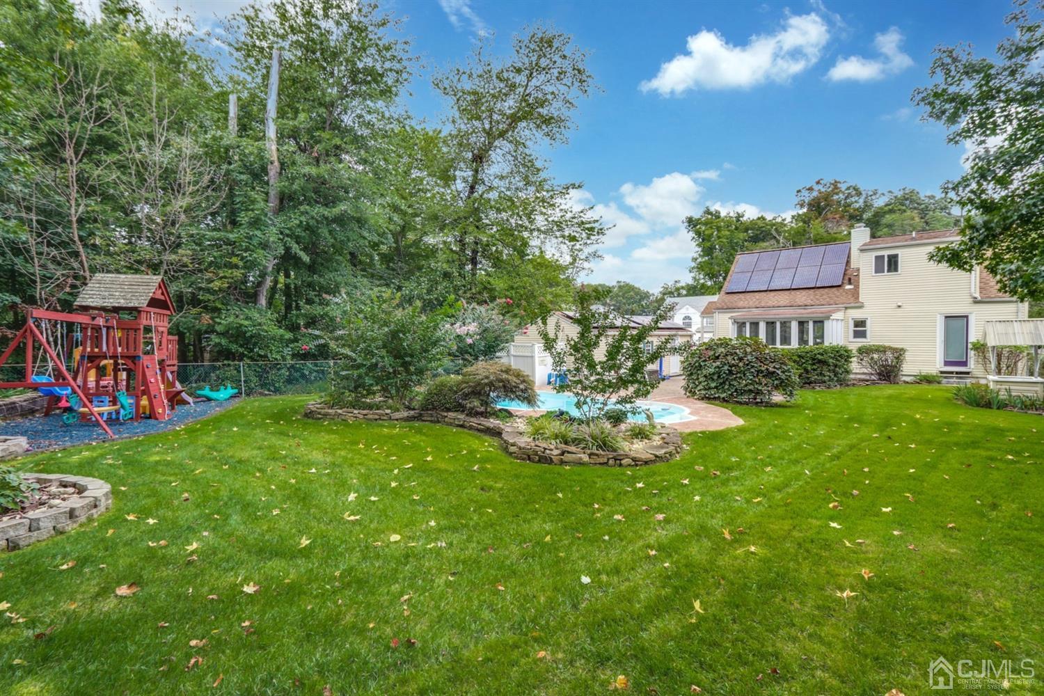 217 Oxford Road Edison, NJ 08820 - Photo 26 of 27 a view of a house with a yard