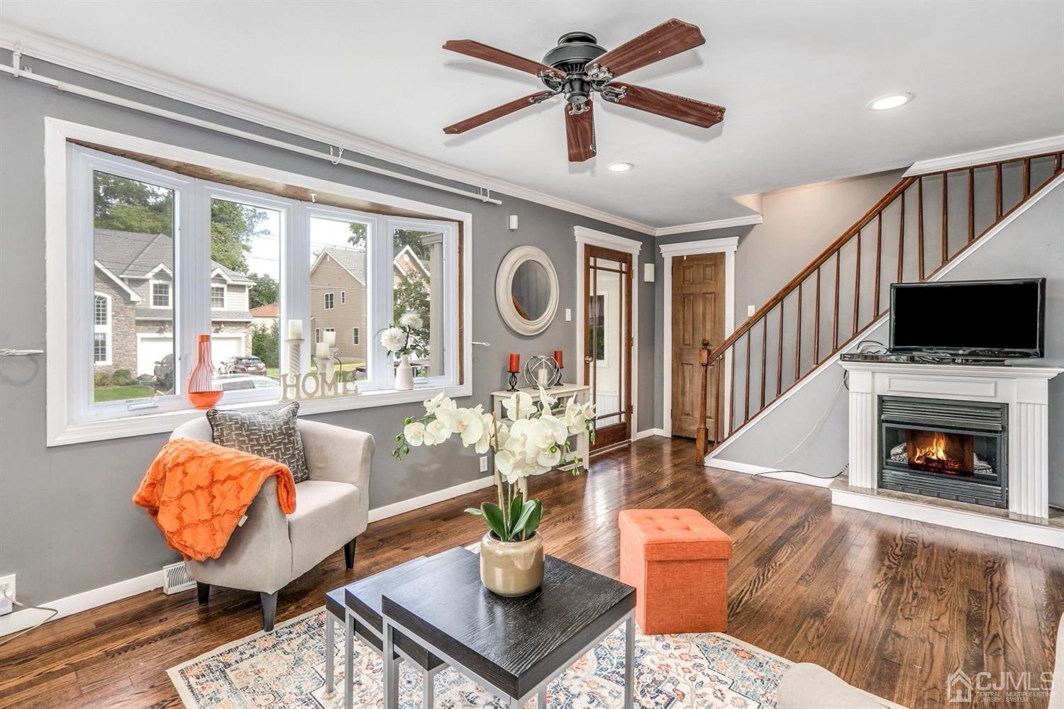 217 Oxford Road Edison, NJ 08820 - Photo 5 of 27 a living room with fireplace furniture and a large window