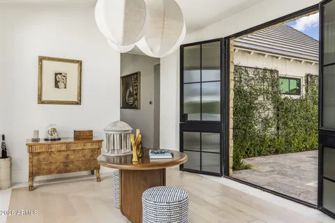 a en suite bathroom with a double vanity sink and a mirror