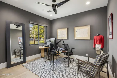 a bathroom with a double vanity sink mirror and bathtub