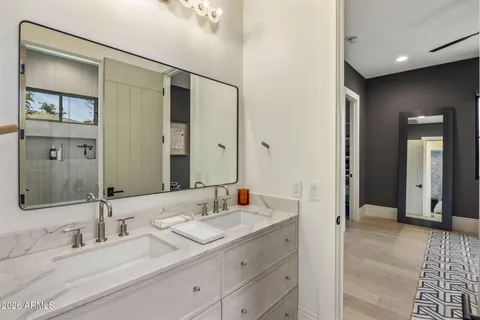 a bathroom with a shower and a sink