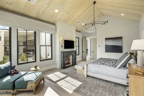 a view of a house with a yard and potted plants