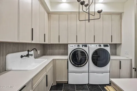 an aerial view of multiple houses with a big yard