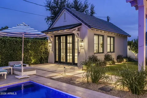 an aerial view of residential houses with city view