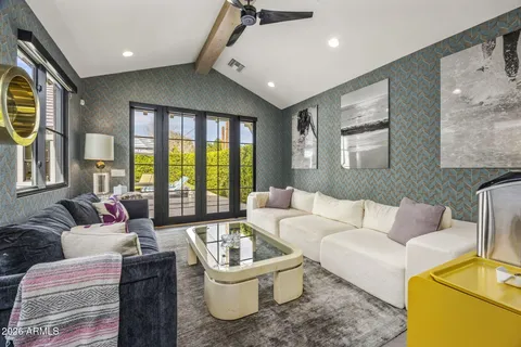 an aerial view of a house with a yard