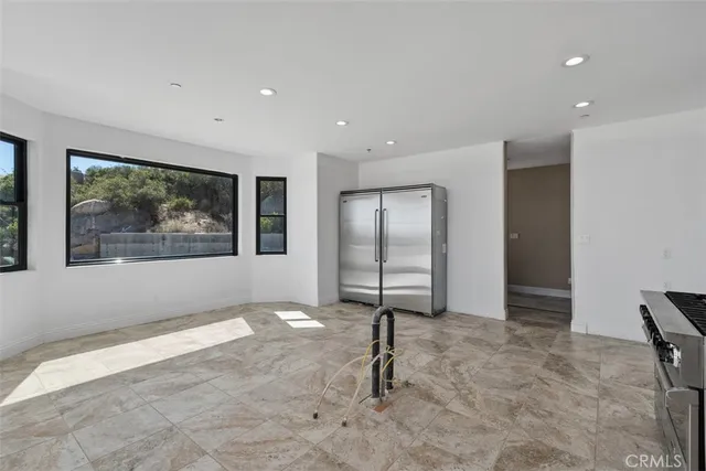 a view of a dining room with furniture window and outside view