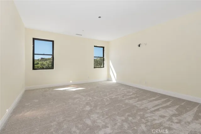 a spacious bathroom with a bathtub and shower