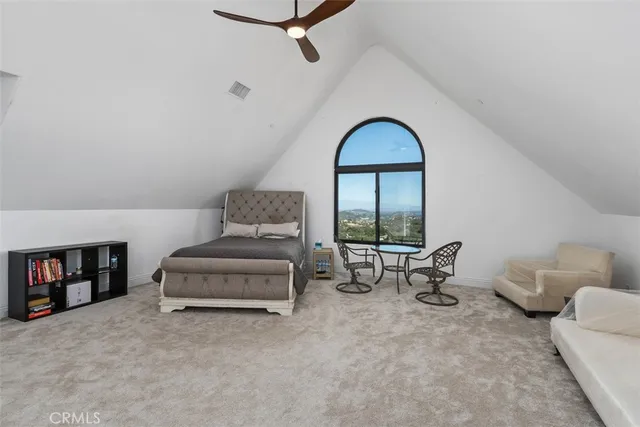 a bathroom with a tub shower and mirror