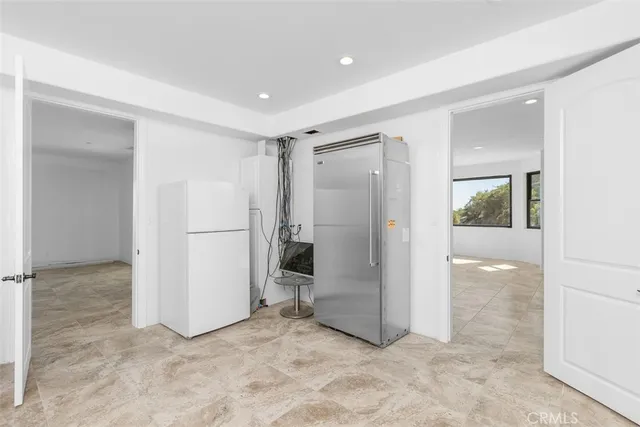 a view of a livingroom with furniture and staircase