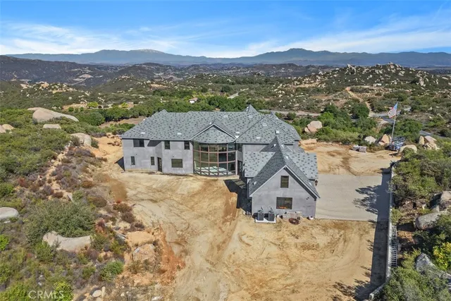 an aerial view of residential houses with a outdoor space
