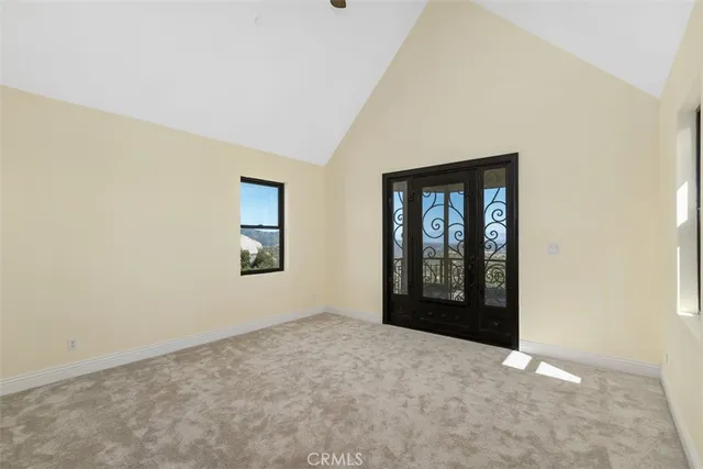 a bed room with a bed and a chair