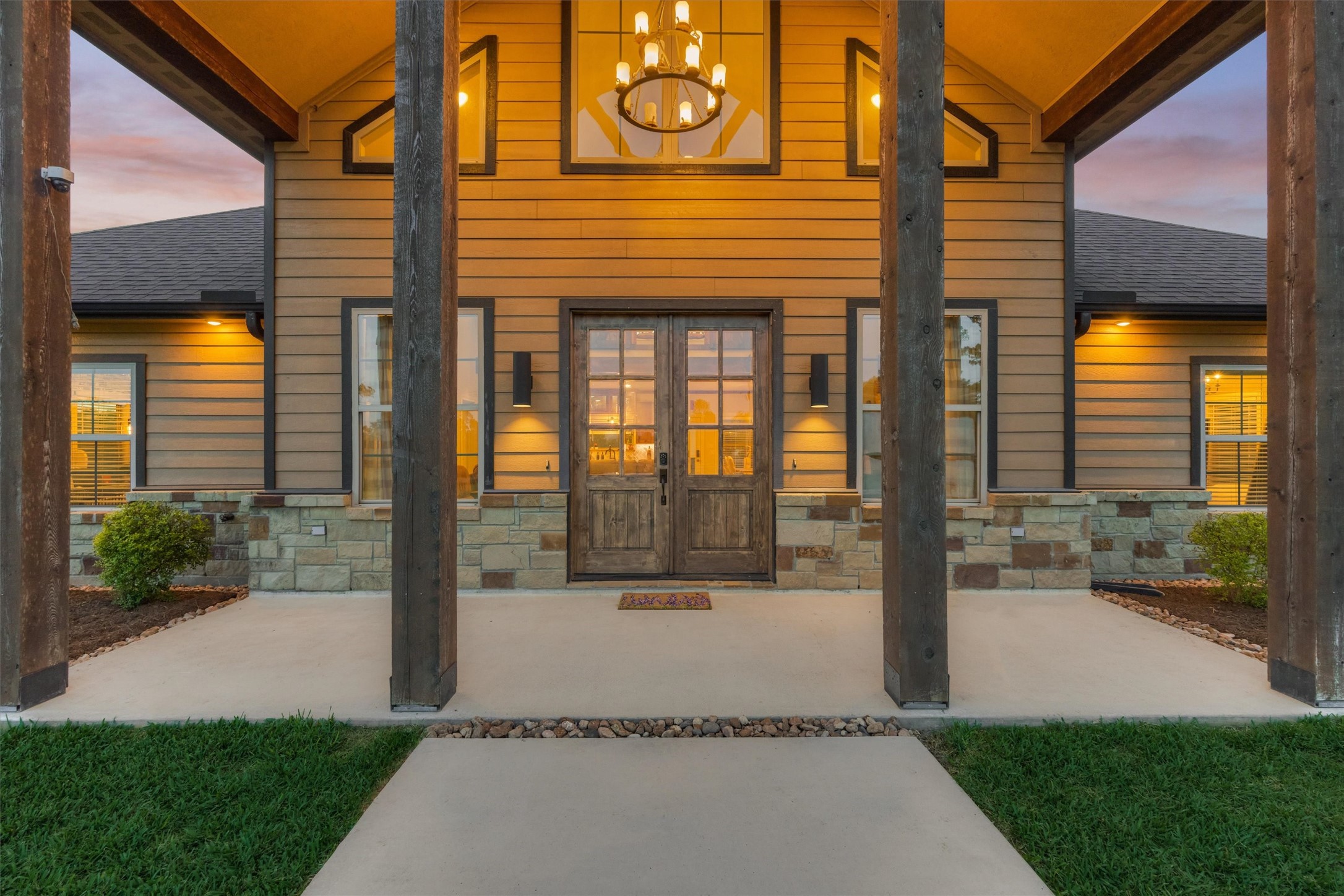 13125 Browder Traylor Road Willis, TX 77378 - Photo 12 of 50 a front view of a house with a yard and potted plants