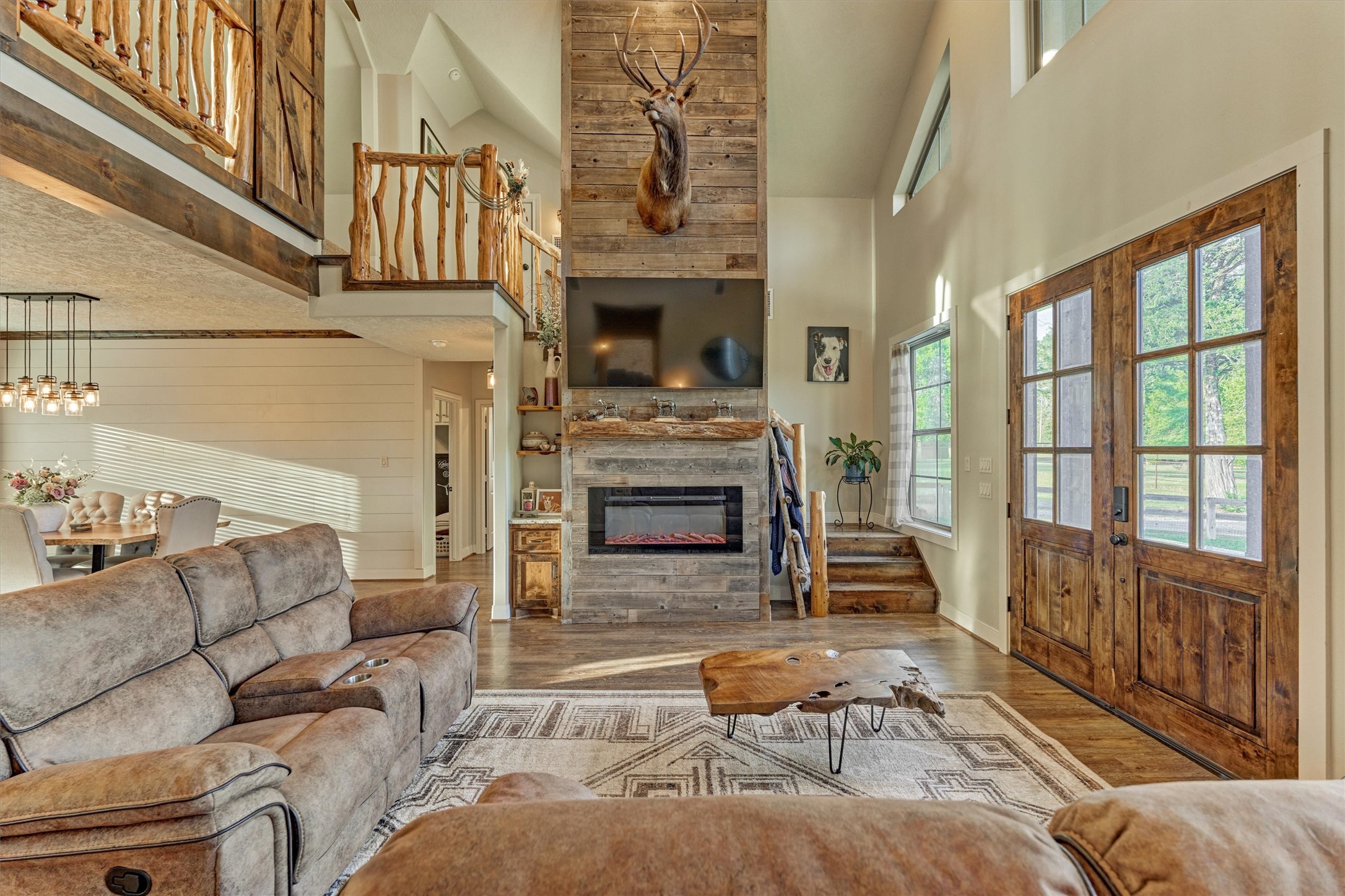 13125 Browder Traylor Road Willis, TX 77378 - Photo 15 of 50 a living room with furniture a fireplace and a large window