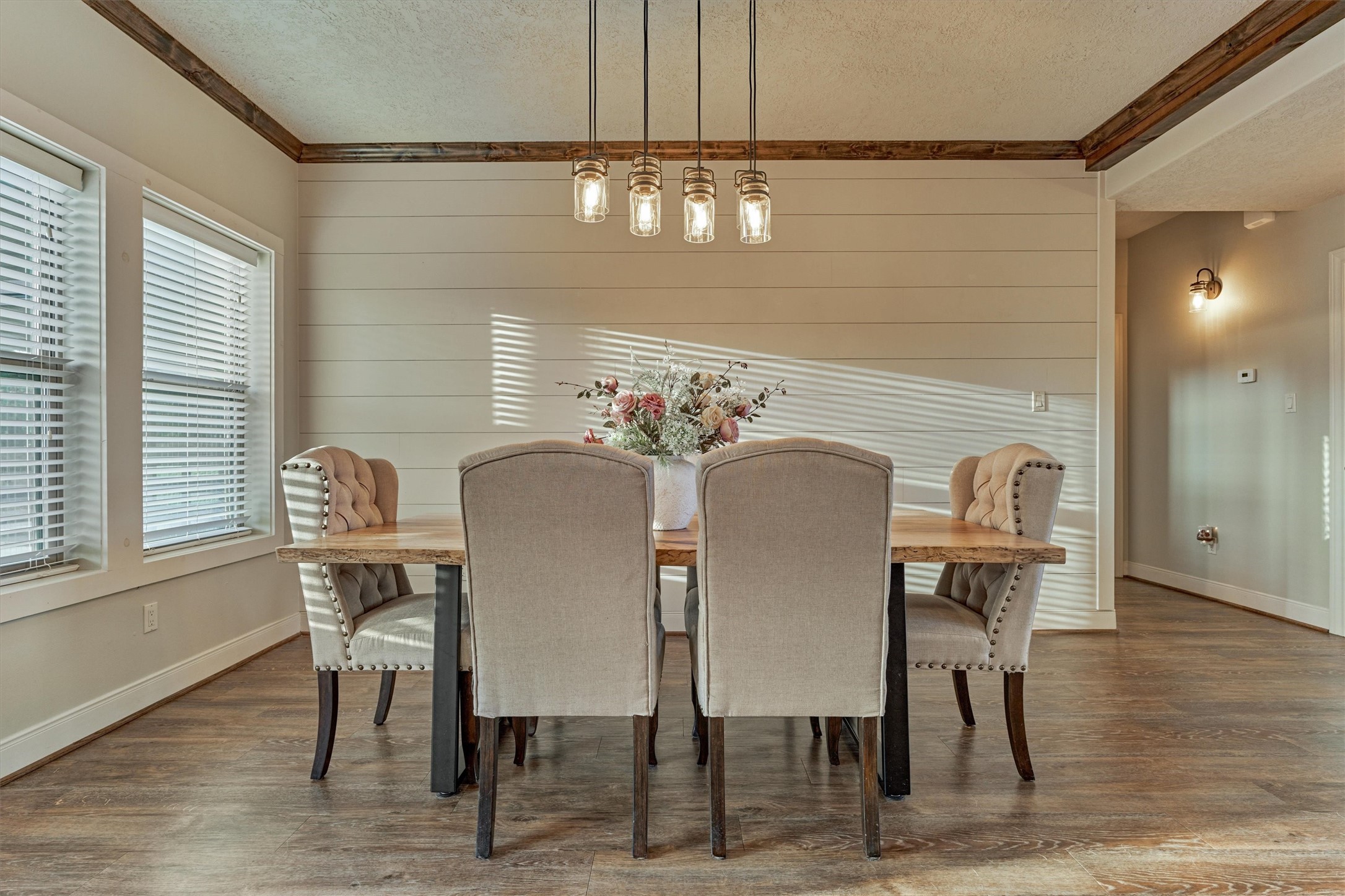 13125 Browder Traylor Road Willis, TX 77378 - Photo 21 of 50 a view of a dining room with furniture wooden floor and chandelier