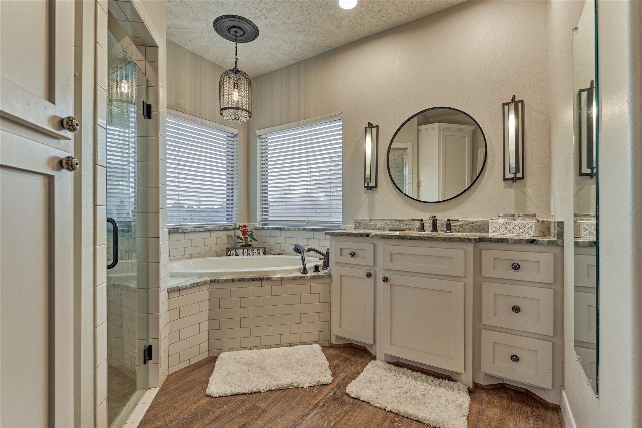 13125 Browder Traylor Road Willis, TX 77378 - Photo 25 of 50 a bathroom with a granite countertop sink mirror and bathtub