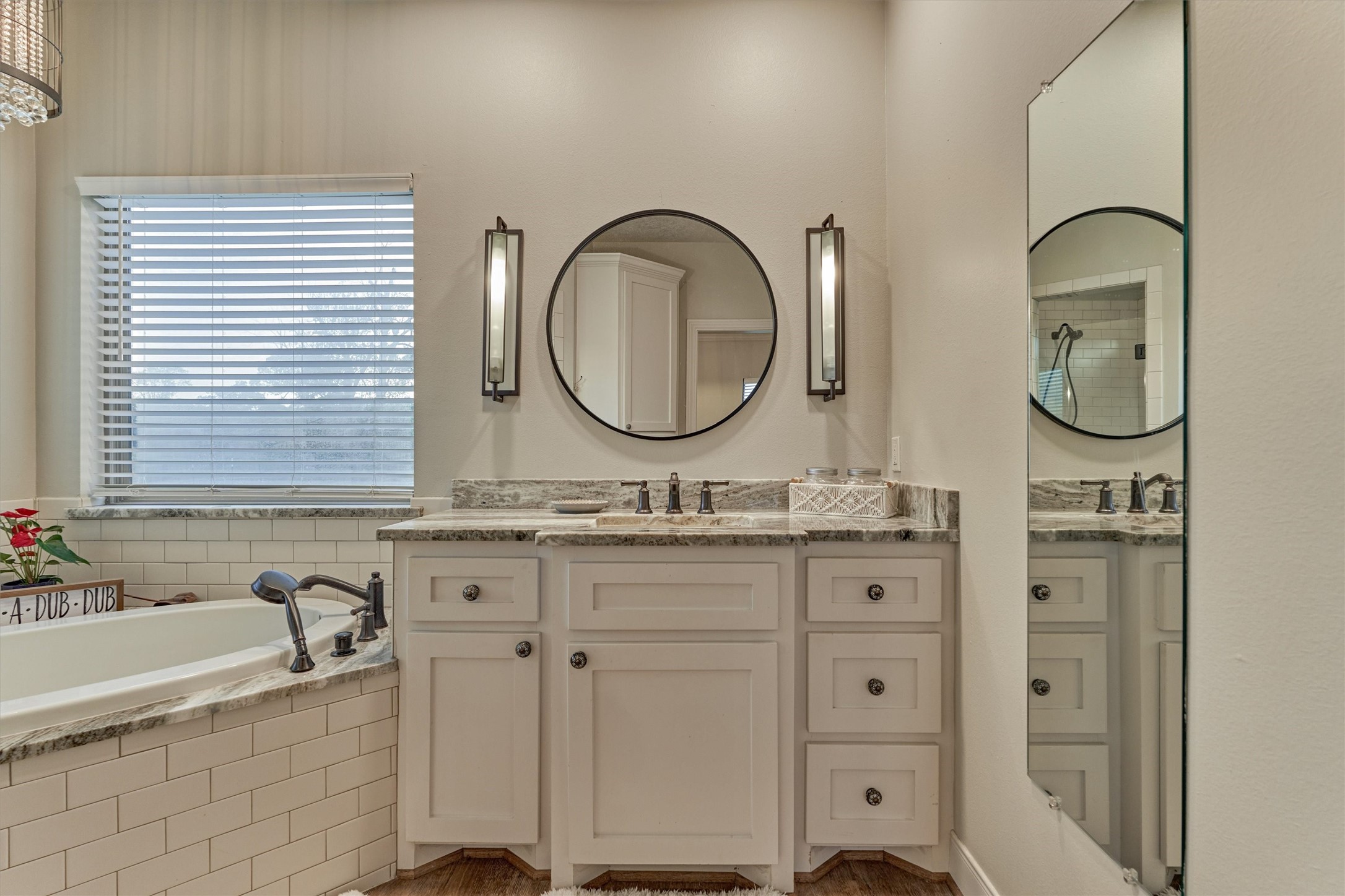 13125 Browder Traylor Road Willis, TX 77378 - Photo 26 of 50 a bathroom with a granite countertop sink and a mirror