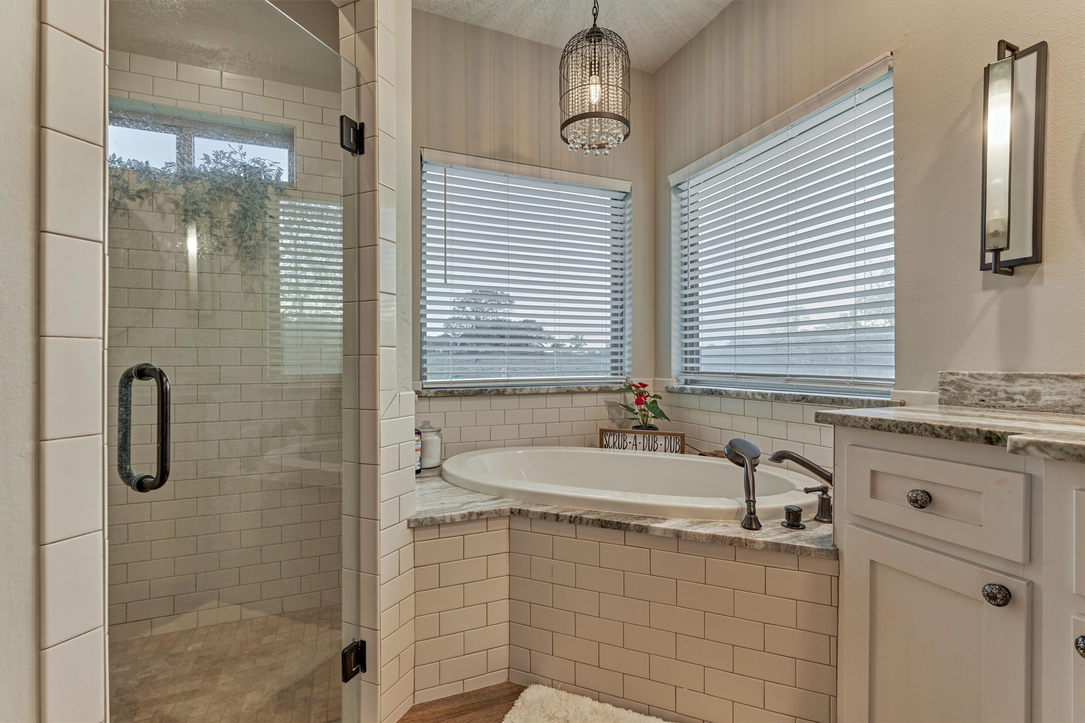 13125 Browder Traylor Road Willis, TX 77378 - Photo 27 of 50 a bathroom with a granite countertop sink a mirror and shower