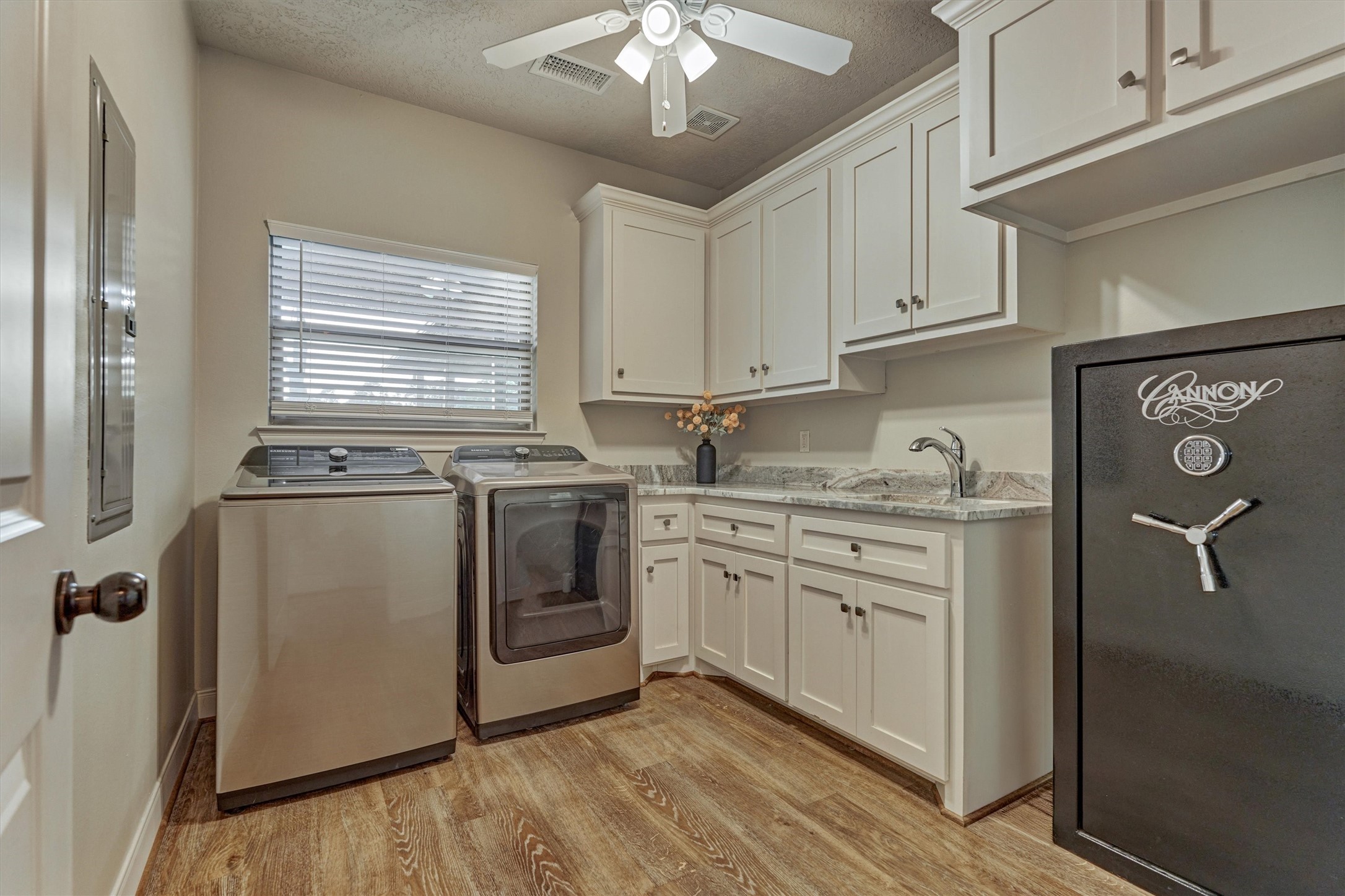 13125 Browder Traylor Road Willis, TX 77378 - Photo 28 of 50 a kitchen with granite countertop a sink cabinets stainless steel appliances and a window