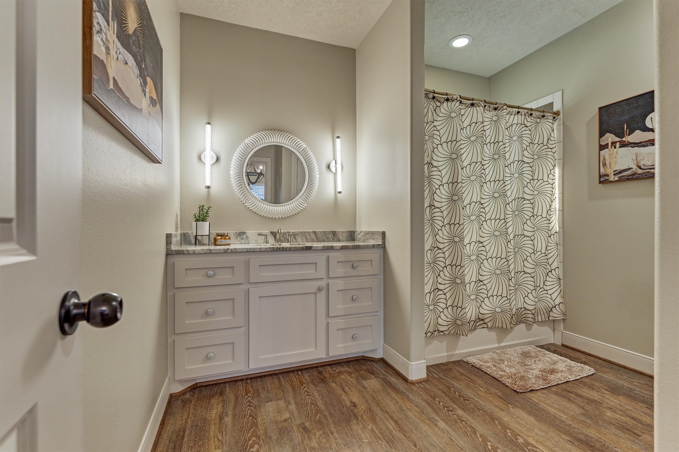 13125 Browder Traylor Road Willis, TX 77378 - Photo 31 of 50 a bathroom with a granite countertop sink a mirror a vanity and a shower