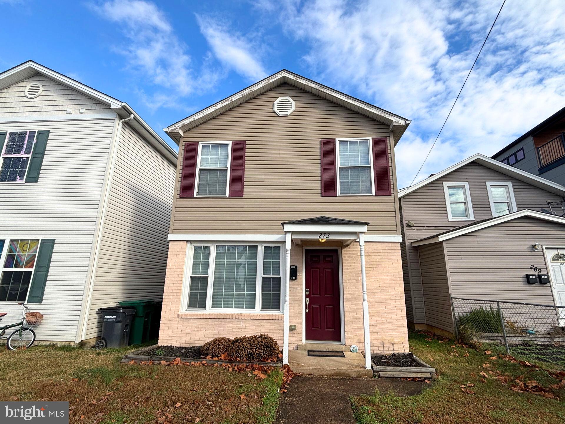 273 4th Avenue, Unit 101 Quantico, VA 22134 - Photo 1 of 36 a front view of a house with a yard