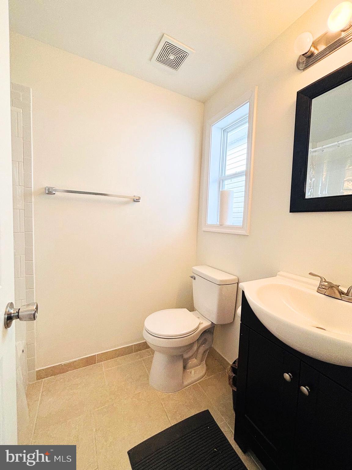 273 4th Avenue, Unit 101 Quantico, VA 22134 - Photo 20 of 36 a bathroom with a sink toilet and mirror