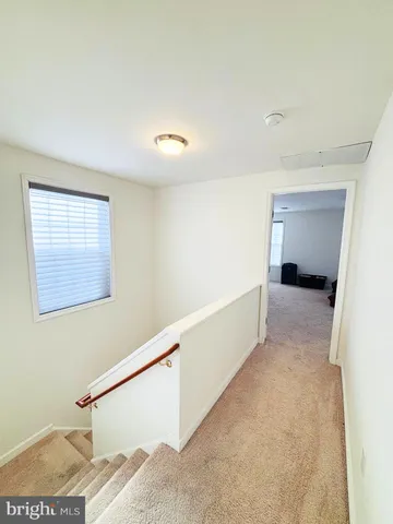 a view of hallway with stairs