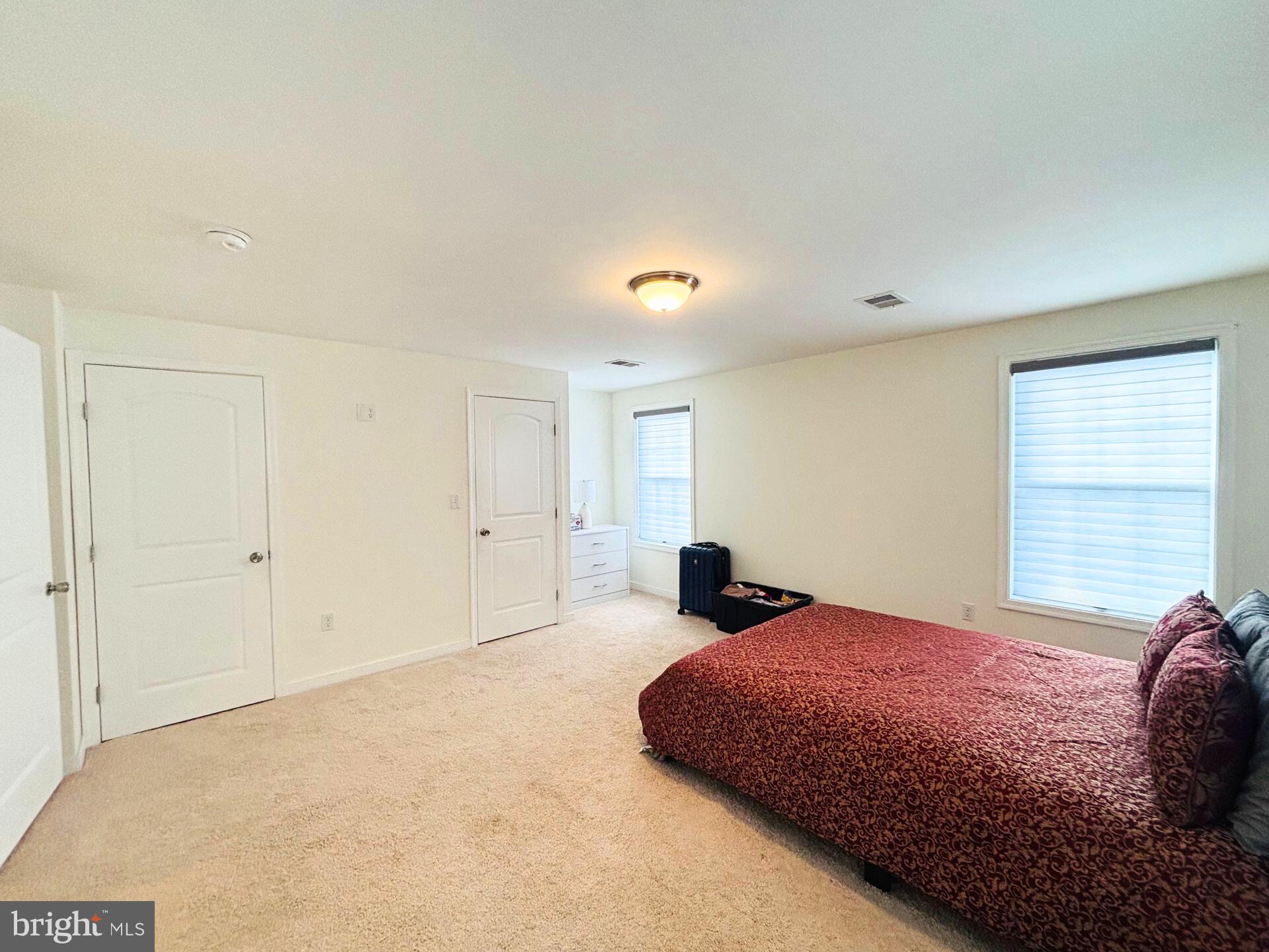 273 4th Avenue, Unit 101 Quantico, VA 22134 - Photo 26 of 36 a bedroom with a bed and a window