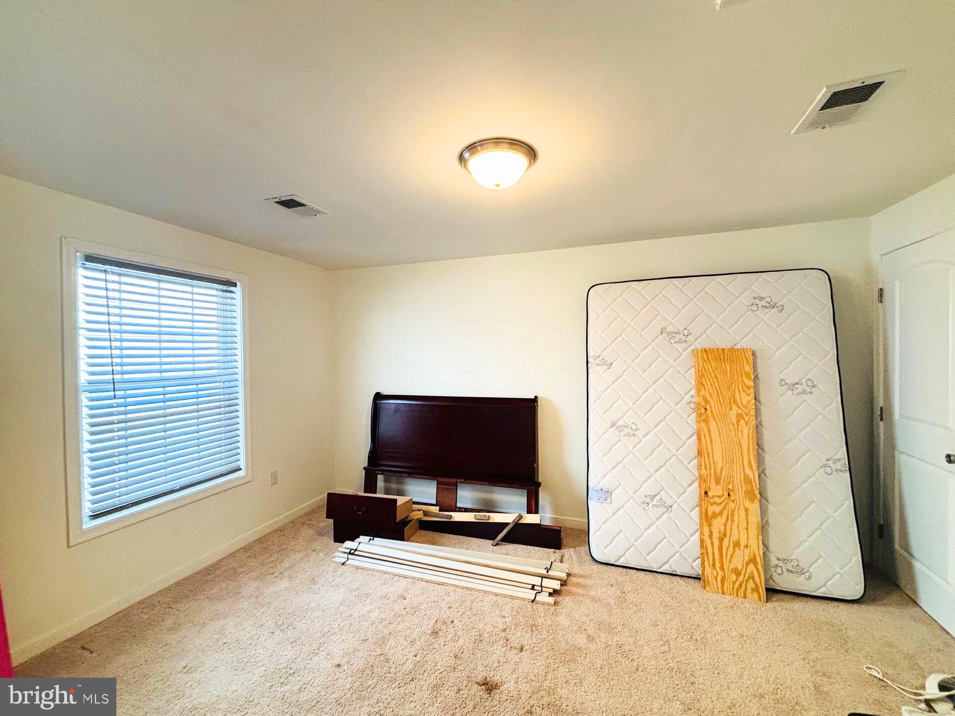273 4th Avenue, Unit 101 Quantico, VA 22134 - Photo 33 of 36 a living room with a flat screen tv and a window