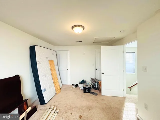 a view of a room with furniture and a window