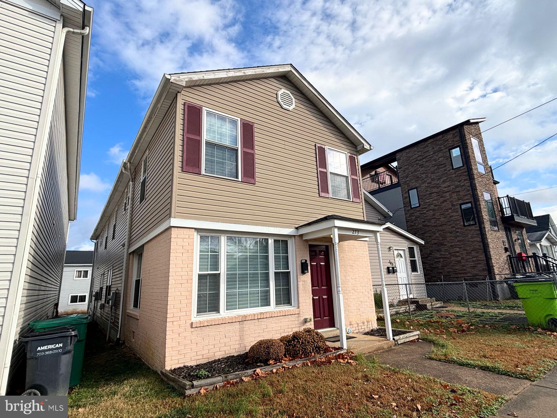 273 4th Avenue, Unit 101 Quantico, VA 22134 - Photo 4 of 36 a front view of a house with a yard